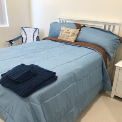 A furnished bedroom inside an ICF/DD home in Reseda.